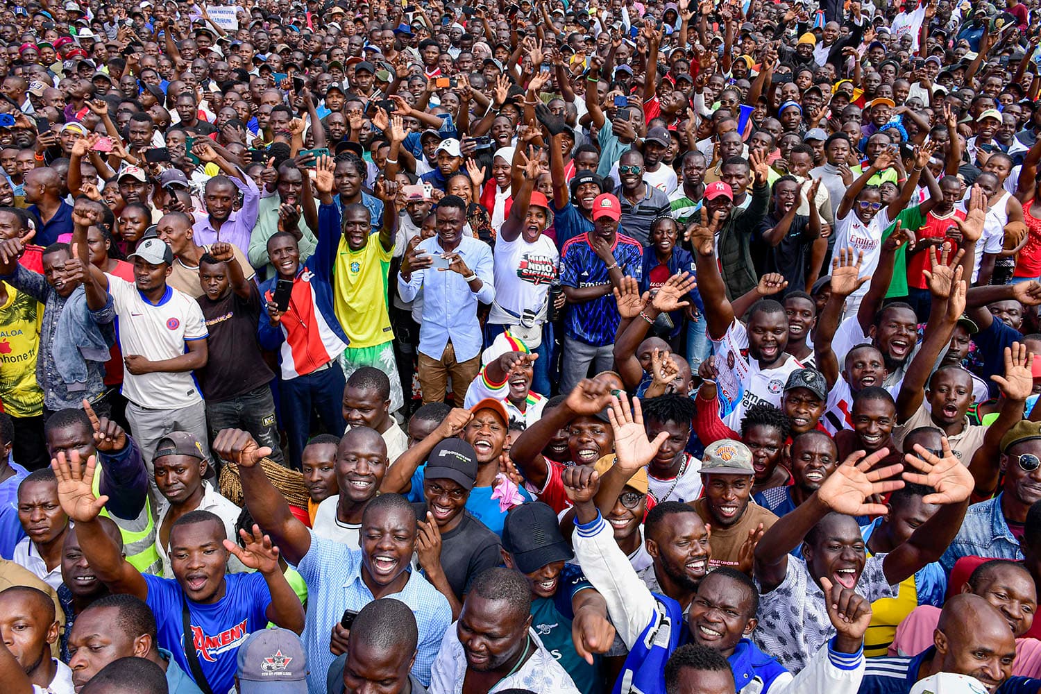 Linda Mwananchi supporters cheering at a rally